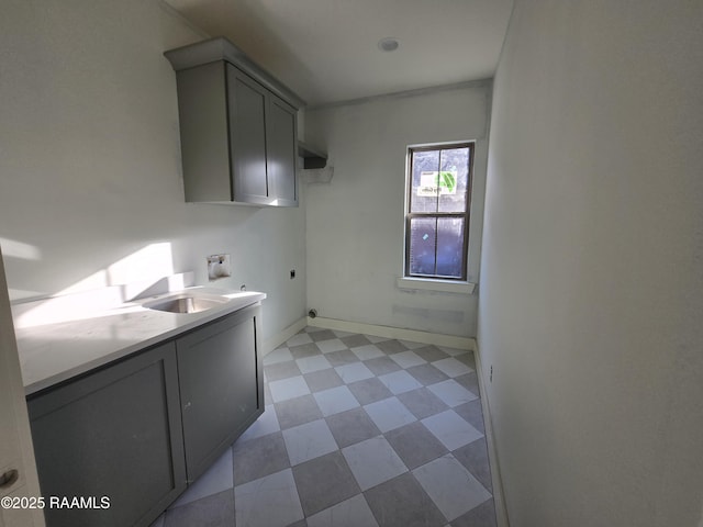 washroom featuring cabinets, washer hookup, hookup for an electric dryer, and sink