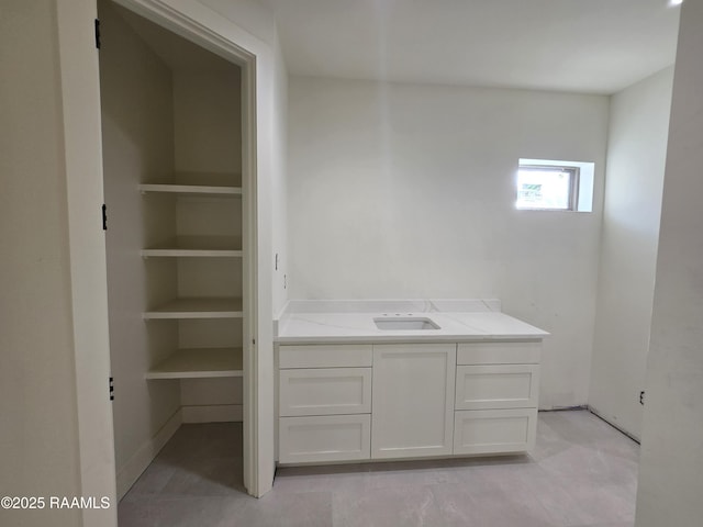 bathroom featuring vanity and built in shelves