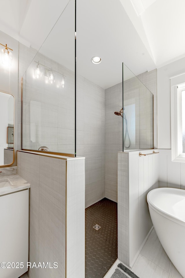 bathroom featuring vanity and plus walk in shower