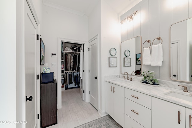 bathroom with vanity and ornamental molding