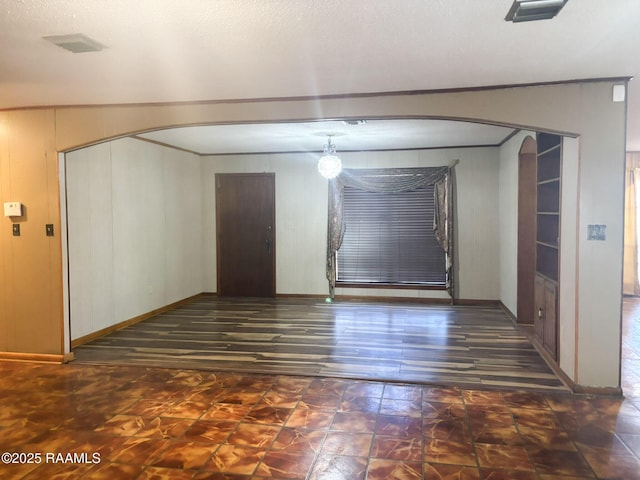 empty room with dark hardwood / wood-style floors