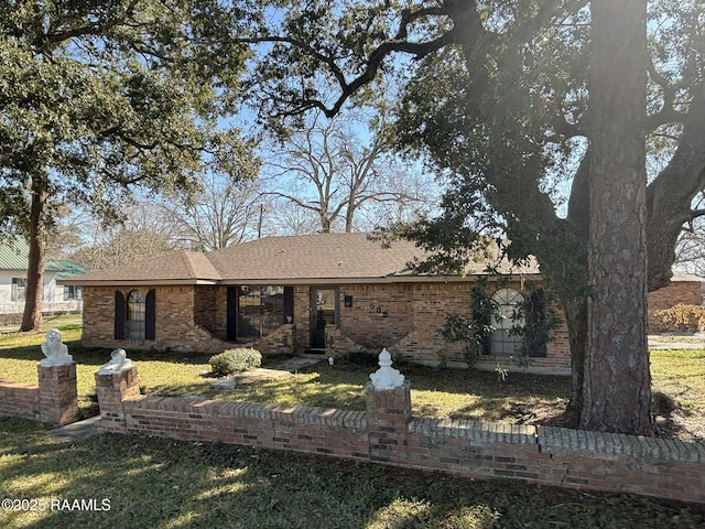 back of property featuring a lawn