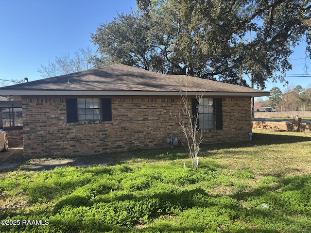 view of home's exterior with a lawn