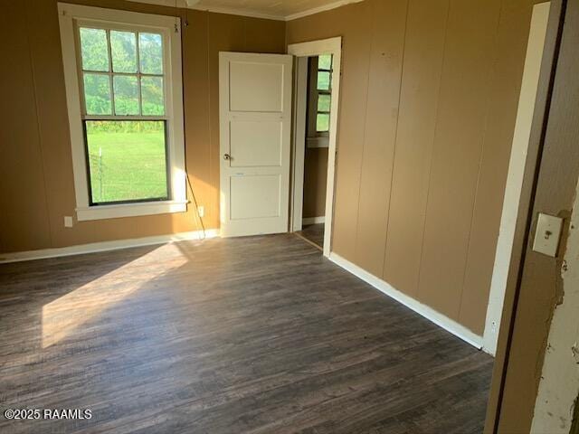 empty room featuring dark hardwood / wood-style flooring