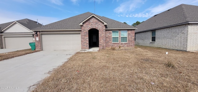 view of front of home with a garage and a front yard