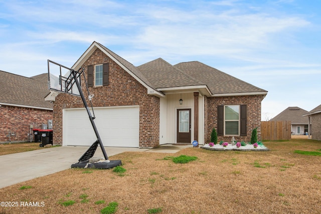 view of front of house with a garage and a front lawn