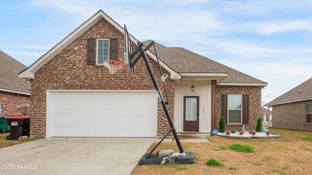 view of property with a garage and a front lawn