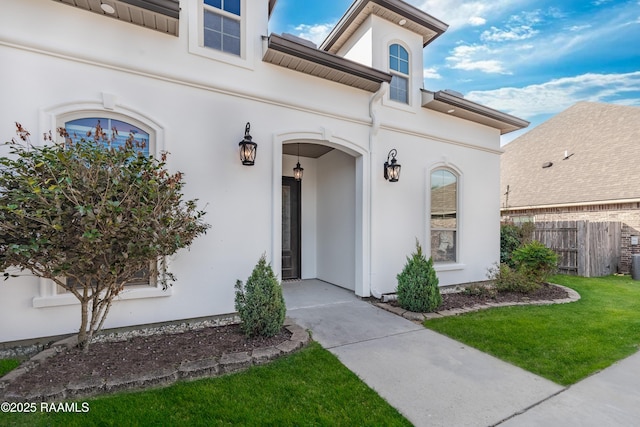 entrance to property with a yard