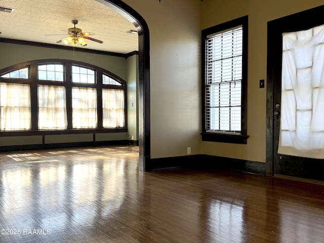 interior space featuring crown molding, ceiling fan, and hardwood / wood-style flooring