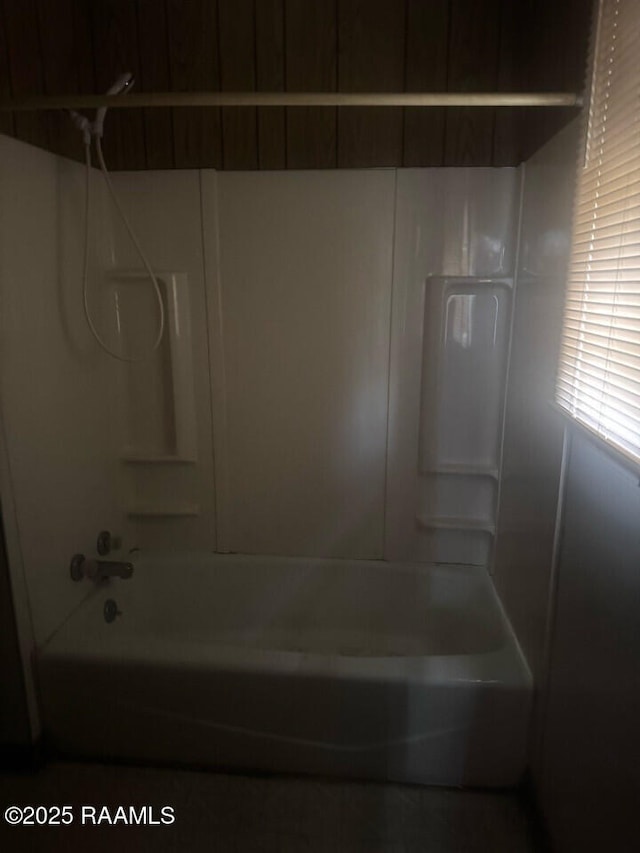 bathroom with bathing tub / shower combination