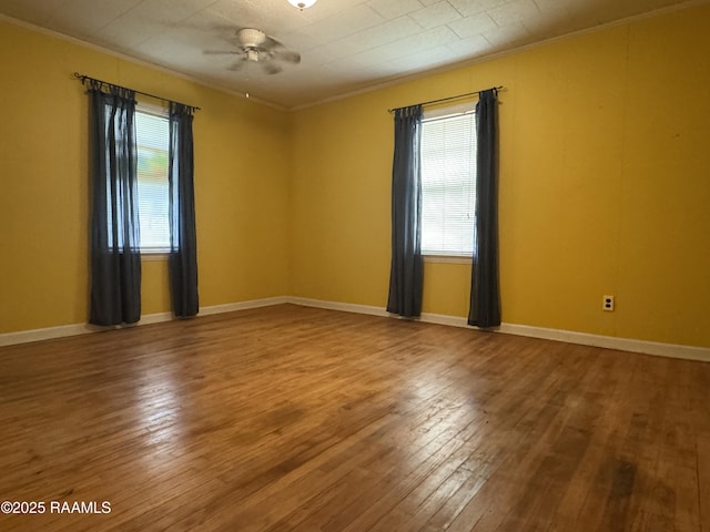 unfurnished room with hardwood / wood-style flooring, ornamental molding, and ceiling fan