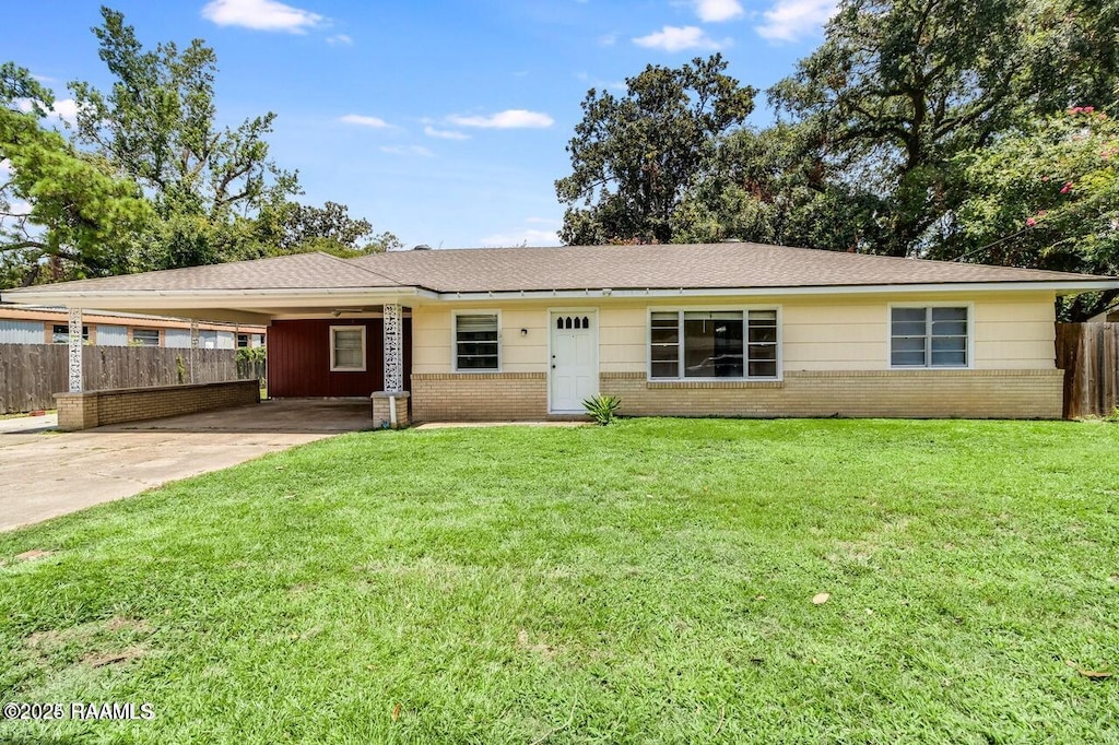 single story home with a carport and a front yard