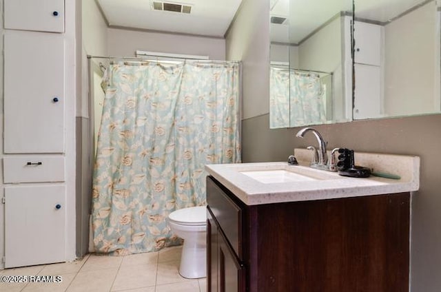 bathroom with vanity, tile patterned floors, and toilet