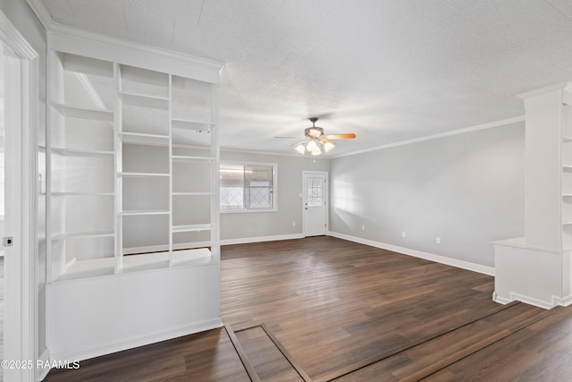 unfurnished living room with dark wood-type flooring, ceiling fan, ornamental molding, and a textured ceiling