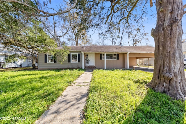 single story home featuring a carport and a front lawn