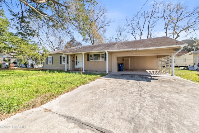 single story home with a front yard and a carport