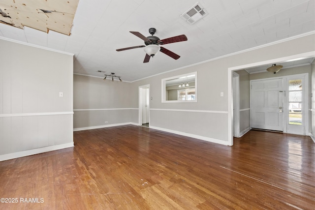 unfurnished living room featuring hardwood / wood-style flooring, ceiling fan, and crown molding