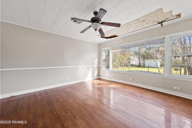 empty room featuring wood-type flooring and ceiling fan