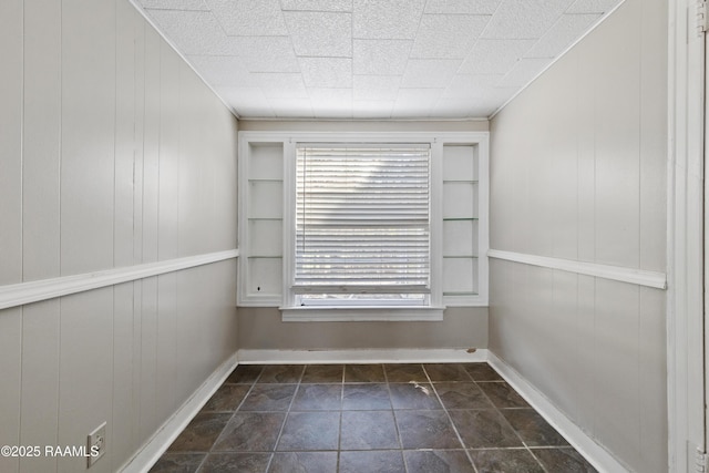 empty room with wood walls