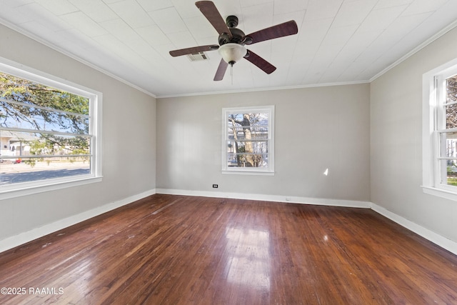 empty room featuring ceiling fan, ornamental molding, and dark hardwood / wood-style flooring