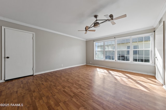 empty room with crown molding, wood-type flooring, and ceiling fan