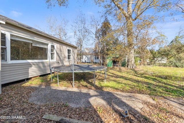 view of yard with a trampoline