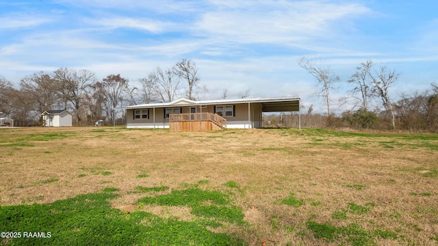 ranch-style home with a storage shed, a front yard, and covered porch