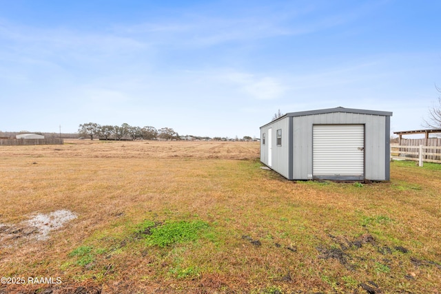 view of yard featuring a storage unit and a rural view