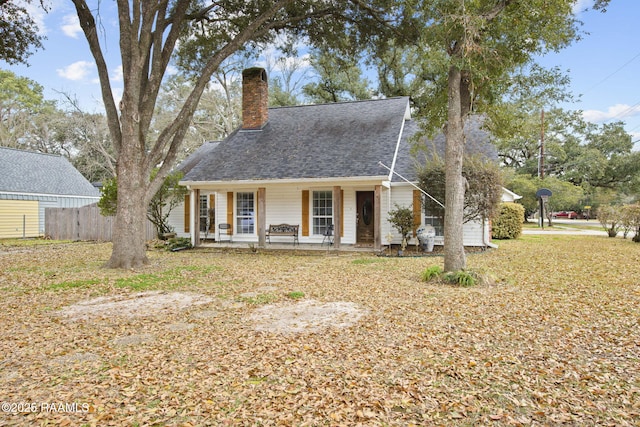 view of front of house with a front lawn and a porch