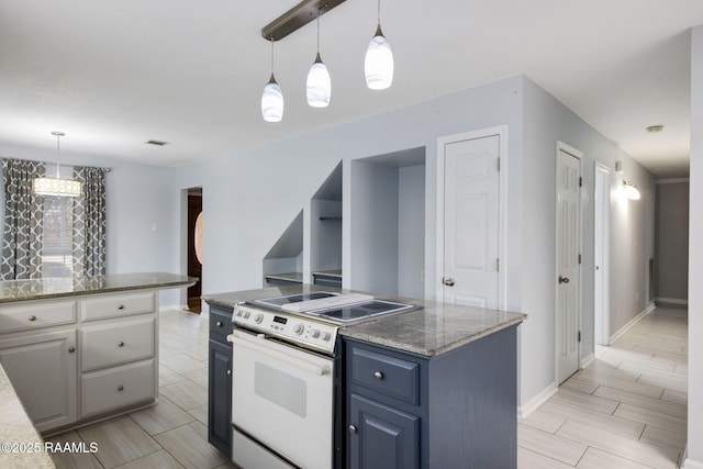 kitchen with pendant lighting, electric range, dark stone counters, and a kitchen island