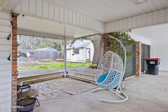 view of patio / terrace featuring an outbuilding