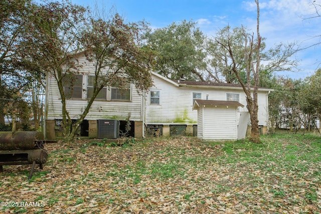 back of property with cooling unit and a storage unit