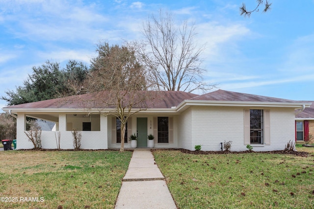 ranch-style home featuring a front yard