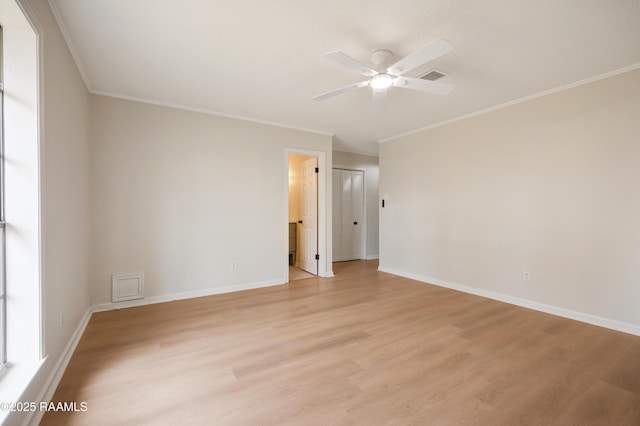 spare room with ornamental molding, light hardwood / wood-style floors, and ceiling fan