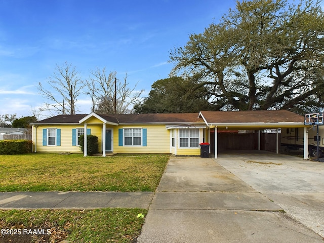 ranch-style home with a carport and a front yard