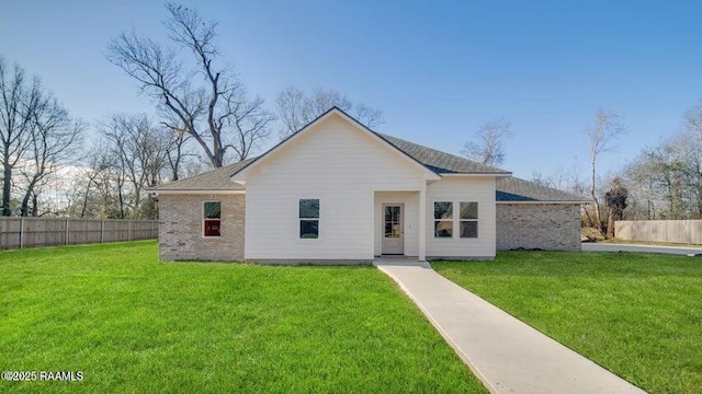 view of front of property with a front lawn