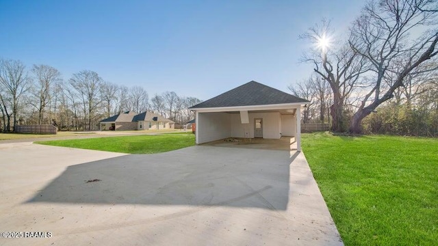 exterior space with a front yard and a carport