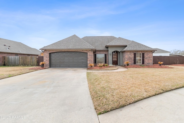 view of front facade with a garage and a front yard