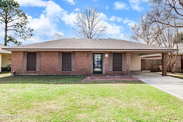 ranch-style home with a front yard and a carport