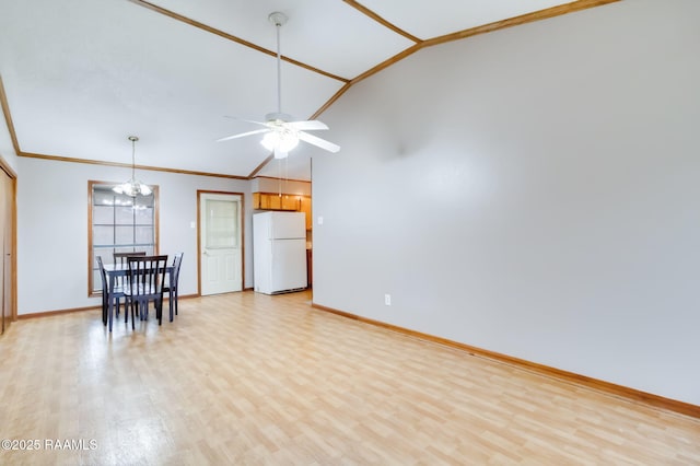 unfurnished living room featuring crown molding, vaulted ceiling, ceiling fan with notable chandelier, and light hardwood / wood-style flooring