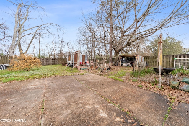 view of yard featuring a fenced backyard and a patio area