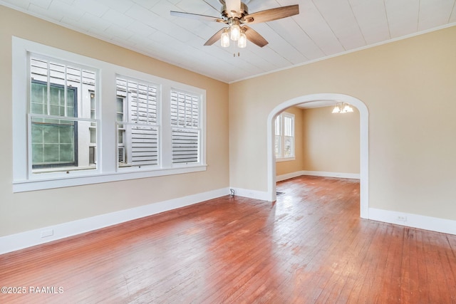 spare room with ceiling fan, ornamental molding, and hardwood / wood-style floors