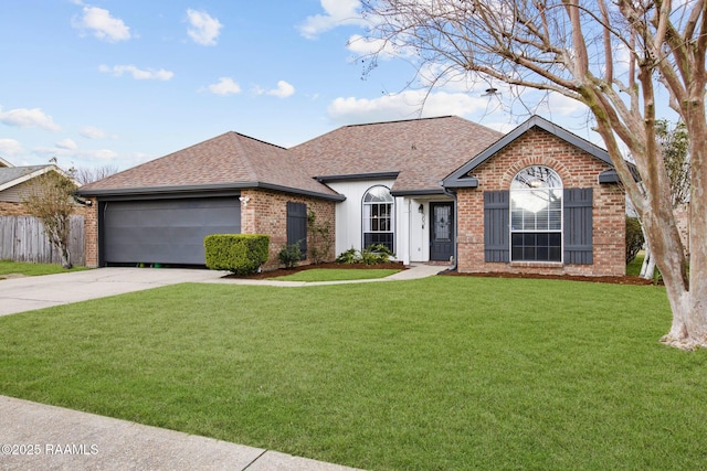 ranch-style home featuring brick siding, a shingled roof, concrete driveway, an attached garage, and a front yard