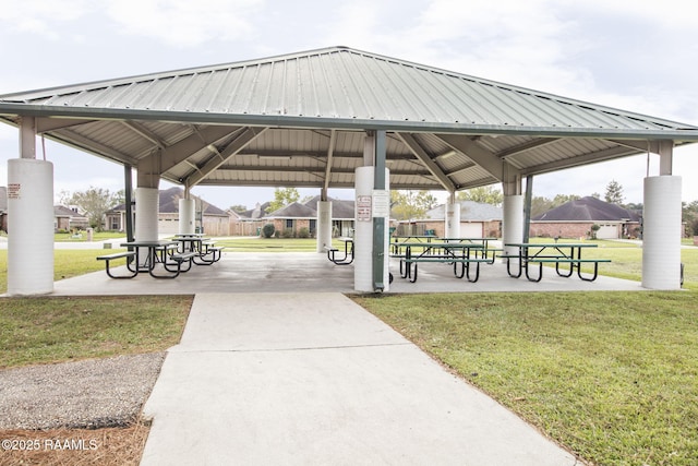 view of property's community with a yard and a gazebo