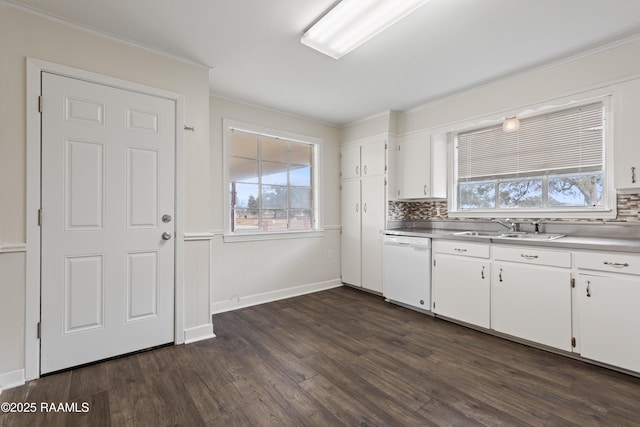 kitchen featuring dishwasher, sink, white cabinets, and dark hardwood / wood-style floors