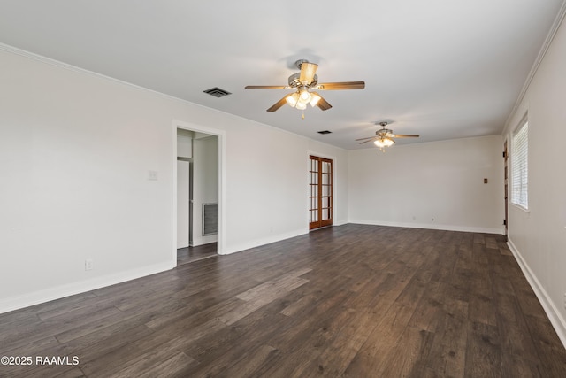 unfurnished room featuring dark wood-type flooring, ceiling fan, ornamental molding, and french doors