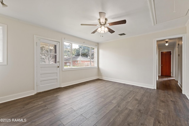 unfurnished room with crown molding, ceiling fan, and dark hardwood / wood-style flooring