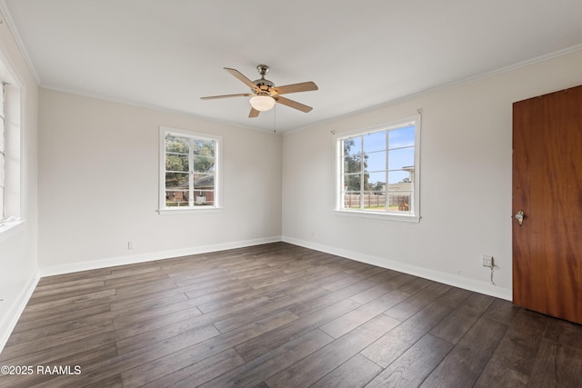 empty room with ornamental molding, plenty of natural light, ceiling fan, and dark hardwood / wood-style flooring