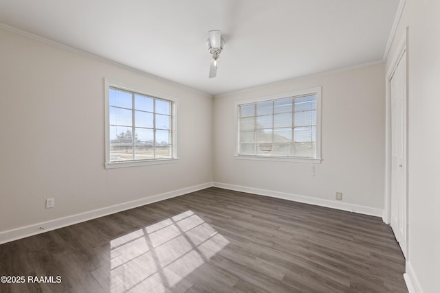 unfurnished bedroom with ornamental molding, dark hardwood / wood-style flooring, and a closet