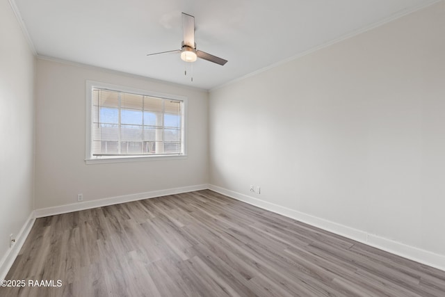 empty room with crown molding, ceiling fan, and light hardwood / wood-style flooring